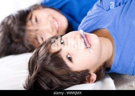 Big sister taking care of her disabled little brother Stock Photo