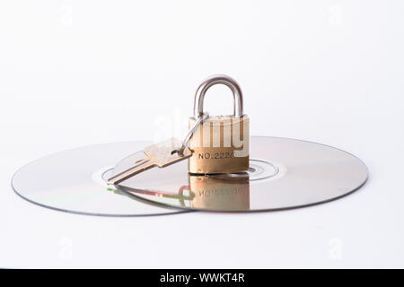 Computer disk and lock isolated on white background Stock Photo