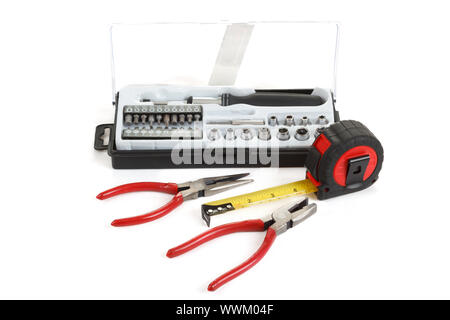 screwdriver toolbox with set of bits, pliers and measuring tape Stock Photo