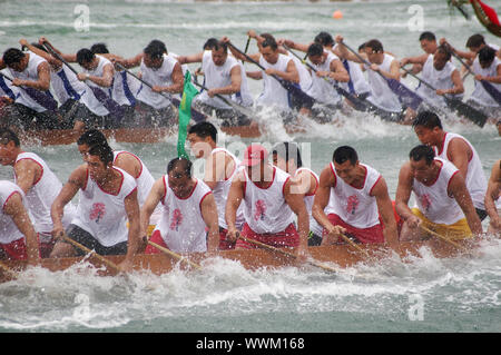 HONG KONG - JUN 16, Dragon boat race in Tung Ng Festival in Tuen Mun, Hong Kong on 16 June, 2010. It is a traditional festival in Chinese community. Stock Photo
