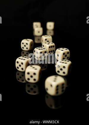 Rolled dices on black background Stock Photo