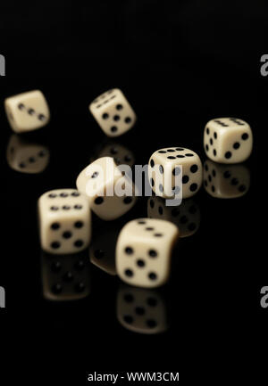 Rolled dices on black background Stock Photo