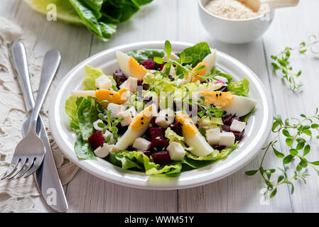 Romaine lettuce salad with beetroot boiled eggs and feta cheese Stock Photo