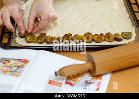 preparing, baking plum cake Stock Photo