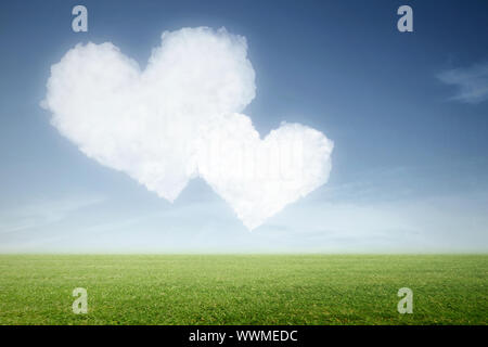 Two heart shaped clouds in the blue sky Stock Photo - Alamy