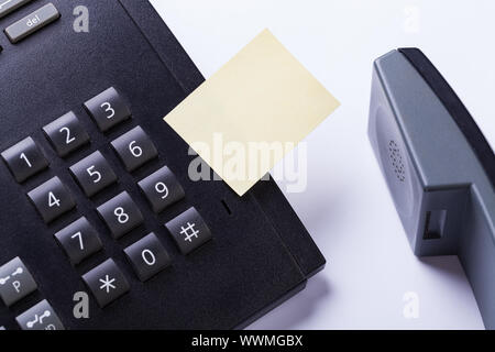 memo post it message on telefone in office Stock Photo