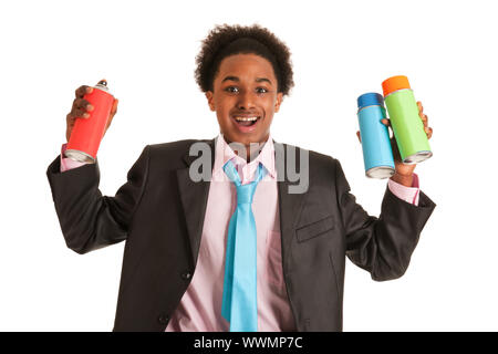 Studio portrait of a young African American man with graffiti aerosols Stock Photo