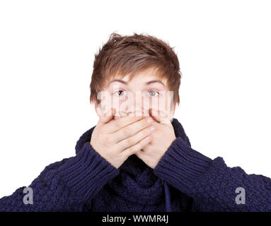 Teenager in a purple sweater shut his mouth with his hands Stock Photo