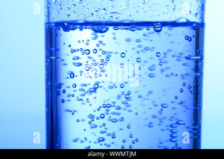 blue bubbled water in glass Stock Photo