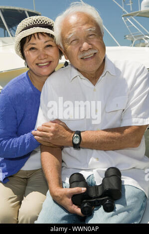 Couple with Binoculars on Boat Stock Photo