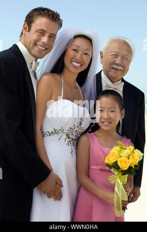 Bride and Groom With Father and Sister Stock Photo