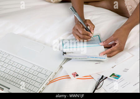 Woman Writing Check Stock Photo
