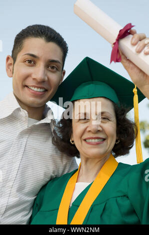 Graduate Mother with Son Stock Photo