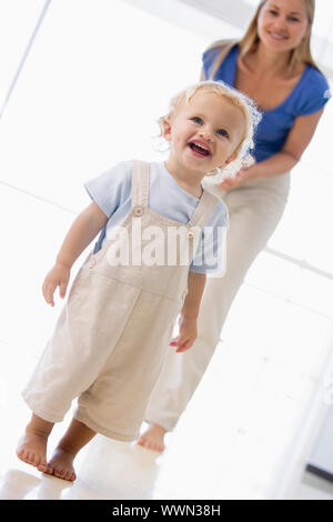 Mother and son indoors smiling Stock Photo
