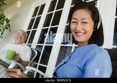 Couple Relaxing on Porch Stock Photo