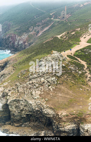 Stunning coastal scenery at Chapel Porth with Wheal Coates Tin mine seen through the mist. Cornwall, England. UK. Stock Photo