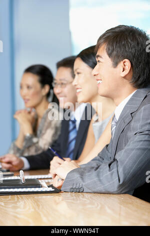 Businesspeople Listening to Speech Stock Photo