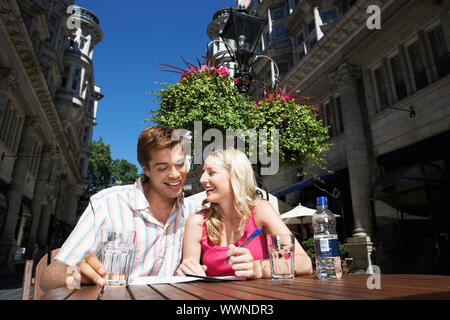 Young Couple at Outdoor Cafe Stock Photo