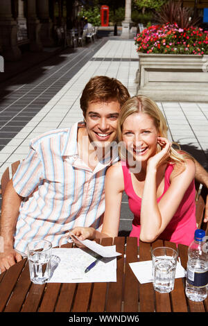 Young Couple at Outdoor Cafe Stock Photo