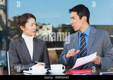 Businesspeople Meeting at Cafe Stock Photo