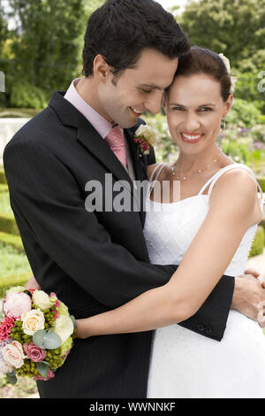 Bride and Groom Hugging Stock Photo
