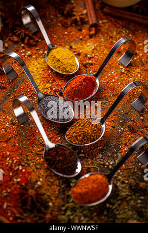 Various spices in spoons, spices and herbs composition Stock Photo