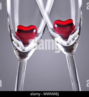 Red jelly hearts in champagne flutes, grey background Stock Photo