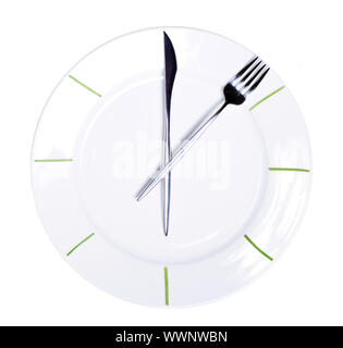 Clock made of knife and fork, isolated on white background Stock Photo
