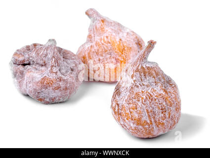 Three dried figs on a white background Stock Photo