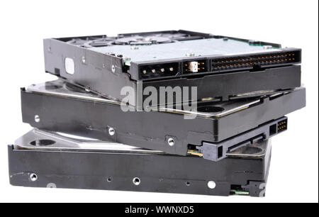Pile of computer hard drives isolated in a white background Stock Photo