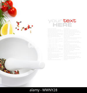 Ceramic Mortar with Pestle, fresh spices and vegetables (with easy removable sample text) Stock Photo