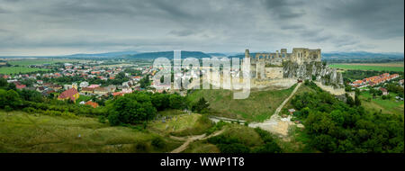 Aerial view of medieval ruined Beckov castle in Slovakia above the Vah river with Gothic chapel and stormy sky Stock Photo