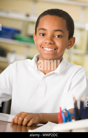Student in class taking notes Stock Photo