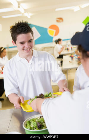 Student having lunch in dining hall Stock Photo