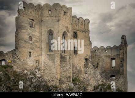 Aerial view of medieval ruined Beckov castle in Slovakia above the Vah river with Gothic chapel and stormy sky Stock Photo