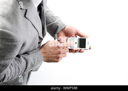 top view of a businesman's hands with a smart phone Stock Photo