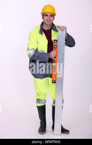 Man using spirit-level Stock Photo