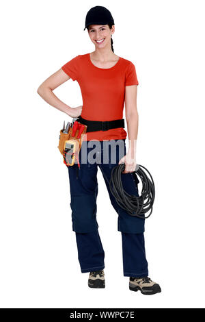 Female electrician raring to go Stock Photo