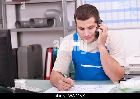 Craftsman in office  on phone Stock Photo