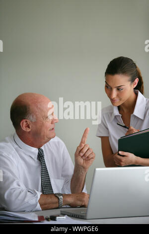 Businessman and his assistant Stock Photo