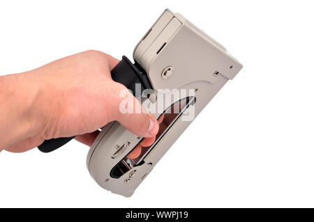 staple gun in hand on a white background Stock Photo