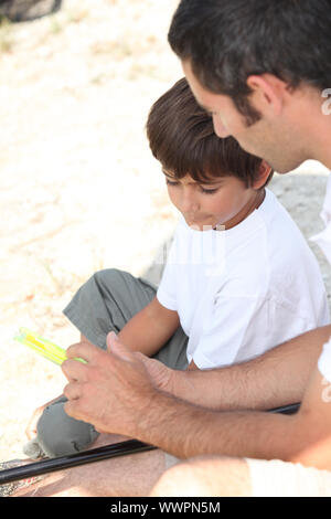 Father and son fishing Stock Photo