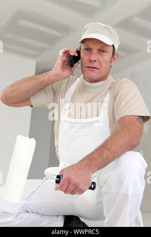 Painter making telephone call Stock Photo