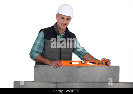 Construction worker using a bubble level Stock Photo