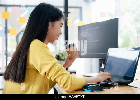 Programmers and developer teams are coding and developing software. Stock Photo