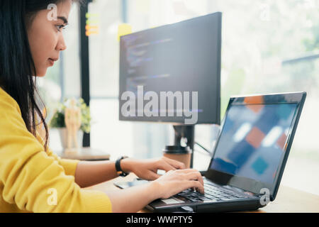 Programmers and developer teams are coding and developing software. Stock Photo
