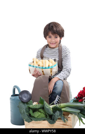 Little boy pretending to be a gardener Stock Photo