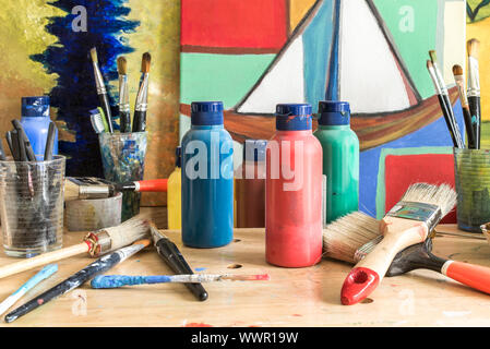 Colors, paintings and paintbrushes in an Atelier in Hamburg Altona Stock Photo