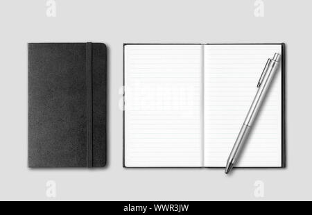 Black closed and open notebooks with pen isolated on grey background Stock Photo