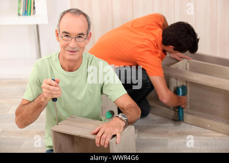 Father and son building furniture Stock Photo